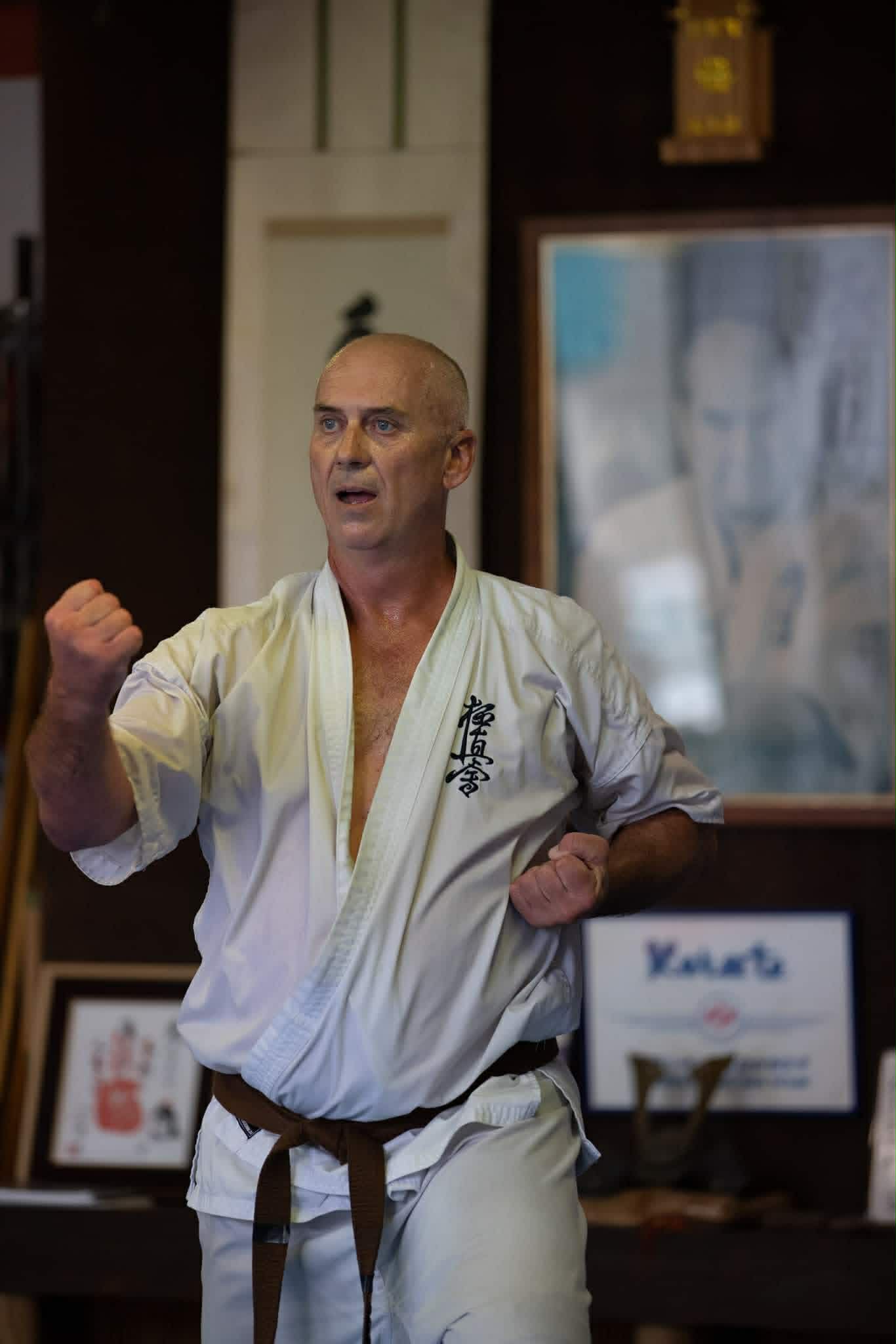 Karate instructor holding a strong stance during class