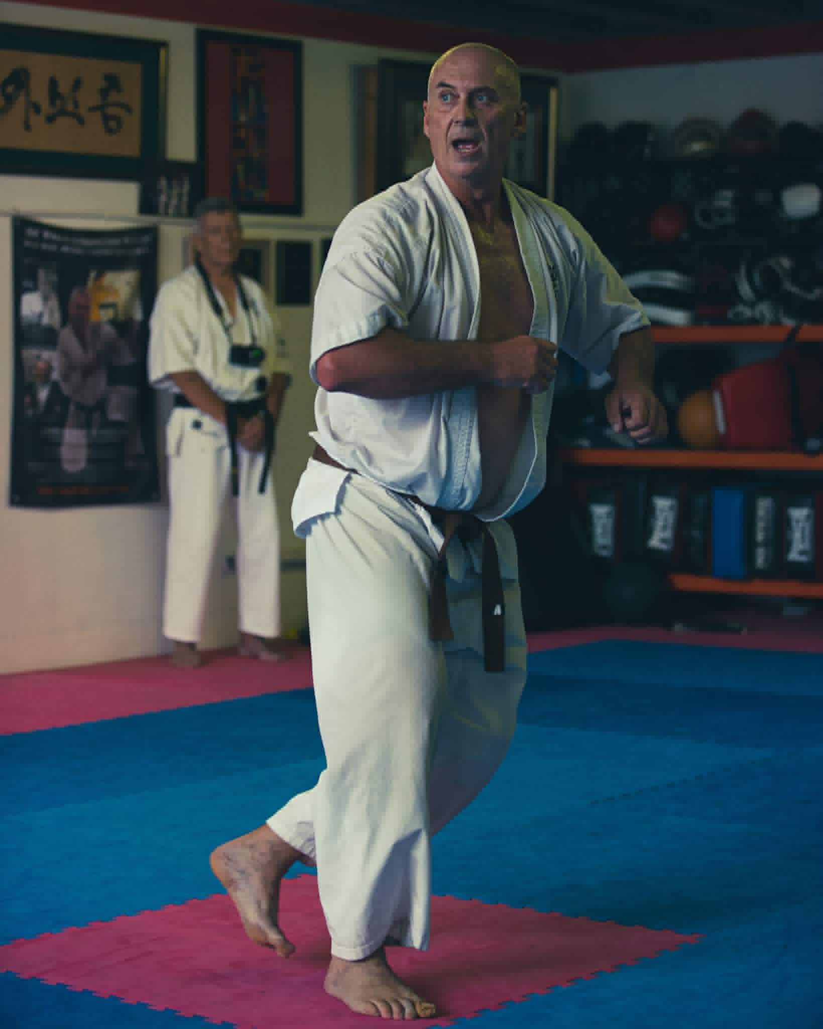 Karate instructor stepping forward in a fighting stance