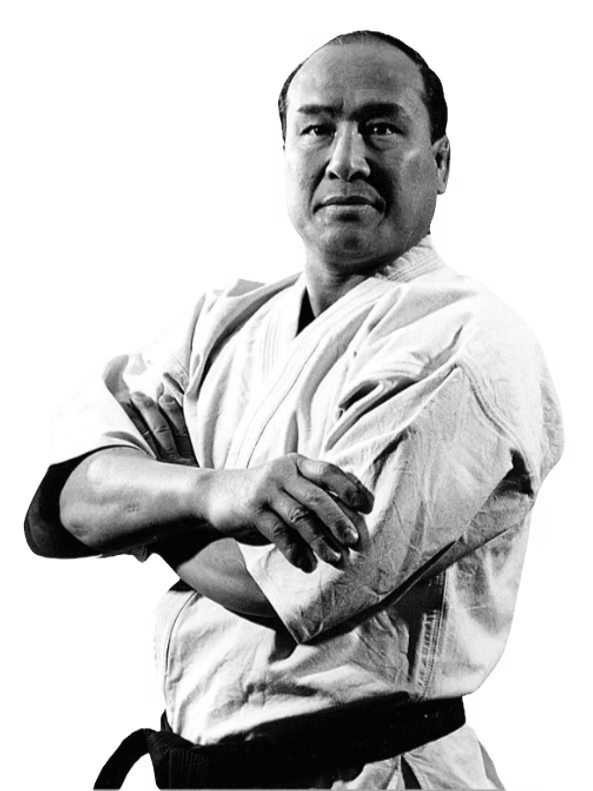 Karate practitioner in a white gi with crossed arms